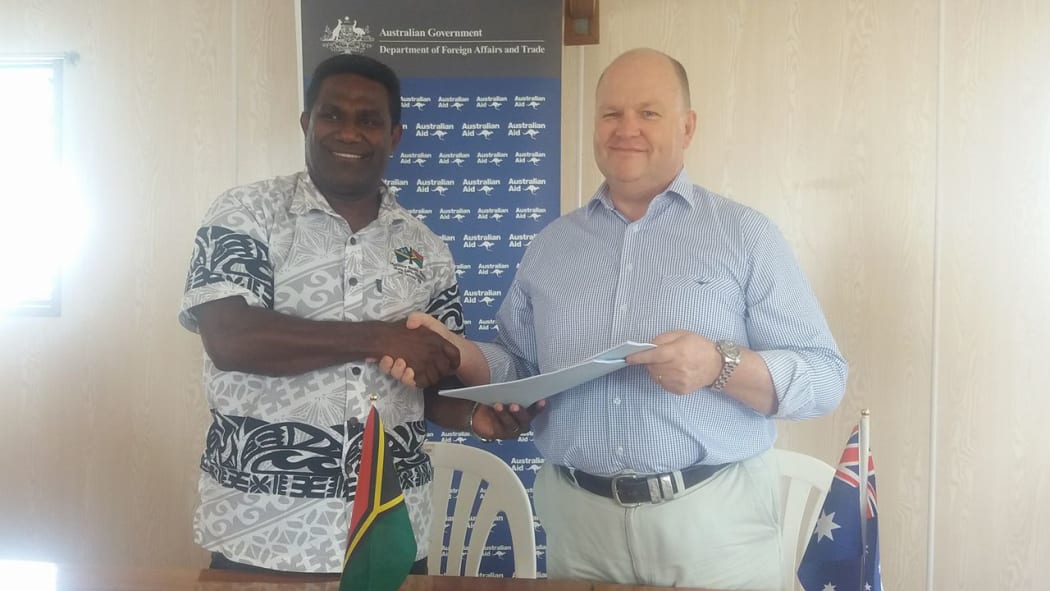 Vanuatu MP Jonny Koanapo and Australian High Commissioner Jeremy Bruer