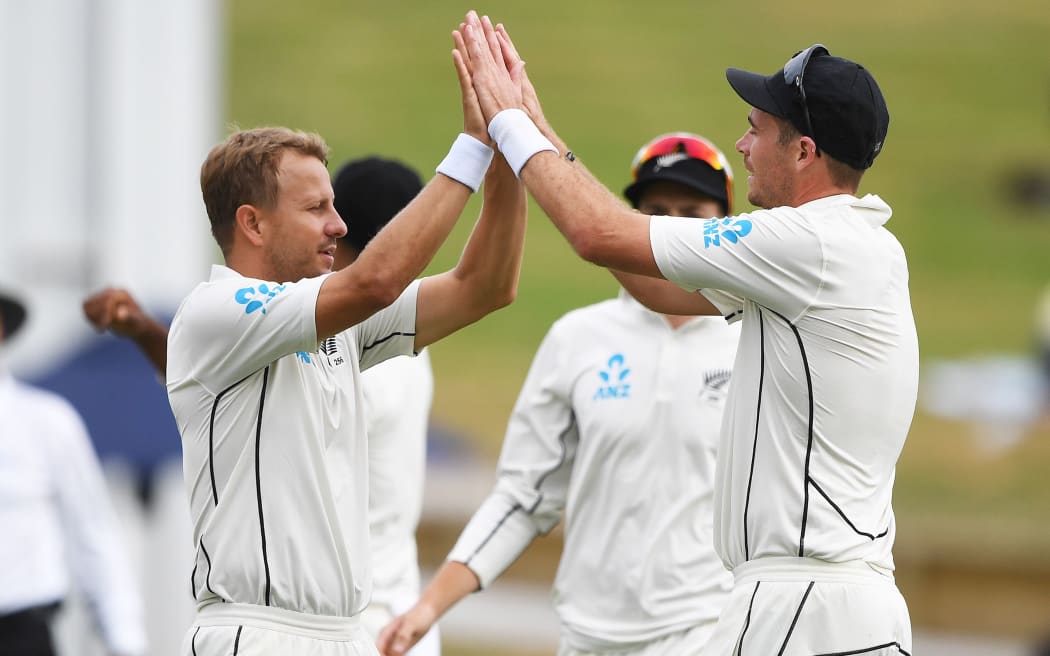 Neil Wagner, left, celebrates a wicket with Tim Southee.