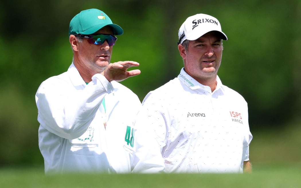 AUGUSTA, GEORGIA - APRIL 11: Ryan Fox of New Zealand prepares for a shot with his caddie, Dean Smith, from the 12th tee during the first round of the 2024 Masters Tournament at Augusta National Golf Club on April 11, 2024 in Augusta, Georgia.   Andrew Redington/Getty Images/AFP (Photo by Andrew Redington / GETTY IMAGES NORTH AMERICA / Getty Images via AFP)