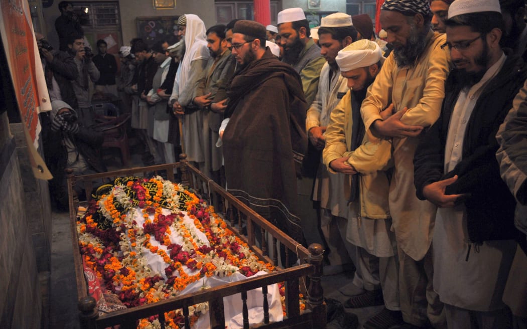 Funerals were under way in Peshawar following the Taliban attack on an army-run school.