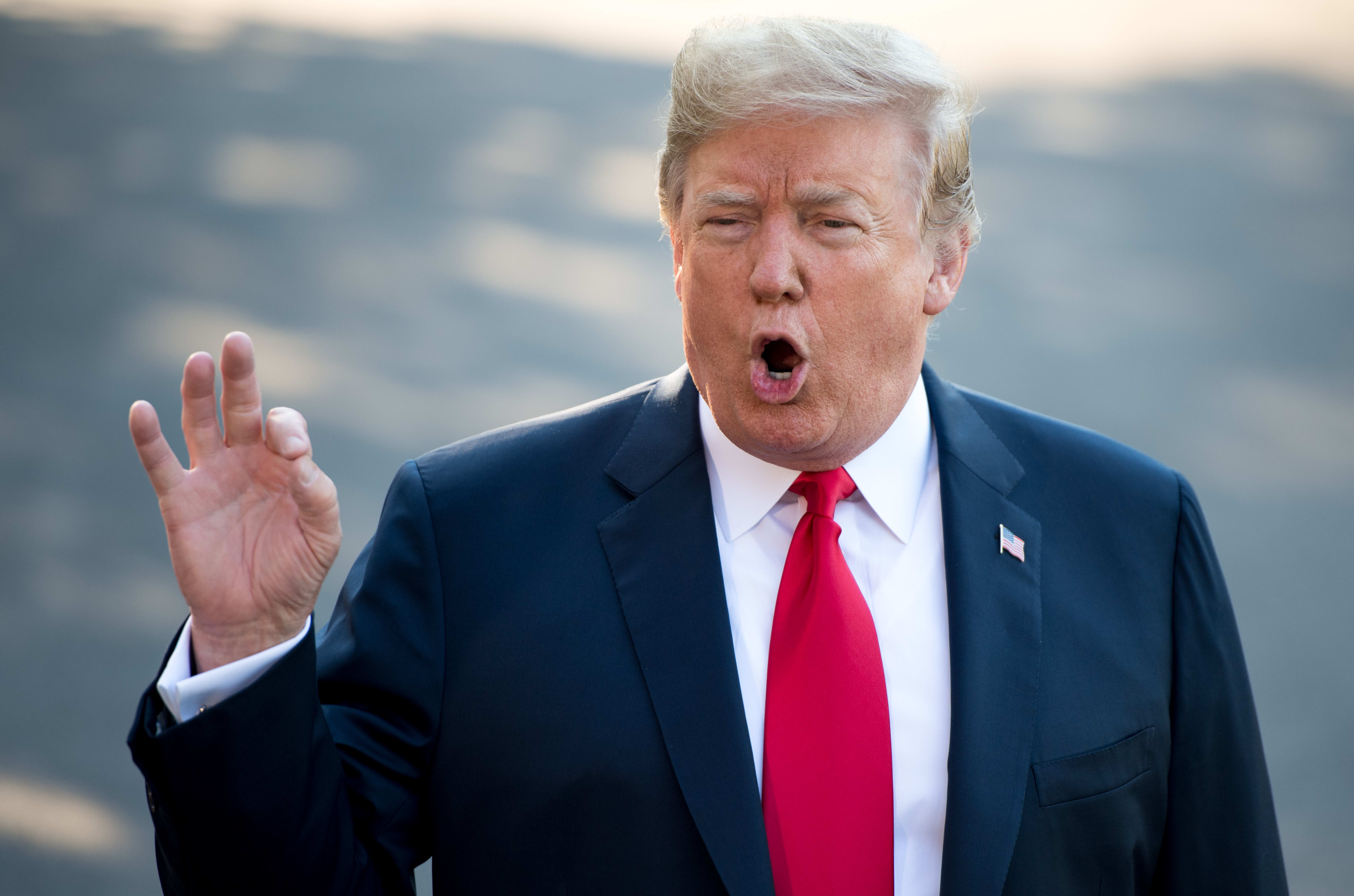US President Donald Trump speaks to the media as he walks to Marine One prior to departure from the South Lawn of the White House in Washington, DC, July 10, 2018, as they travel on a week-long trip to Europe, with stops in Brussels, London, Scotland and Helsinki.