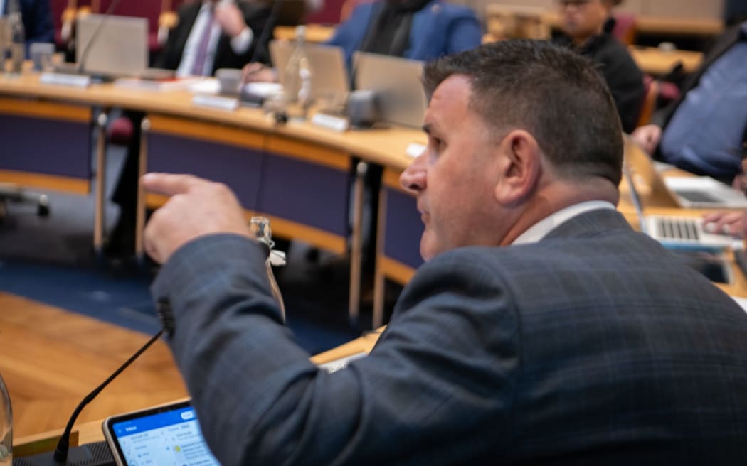 Mayor Neil Holdom ejected Chong, who repeated the racism accusation three times despite being told to sit down.