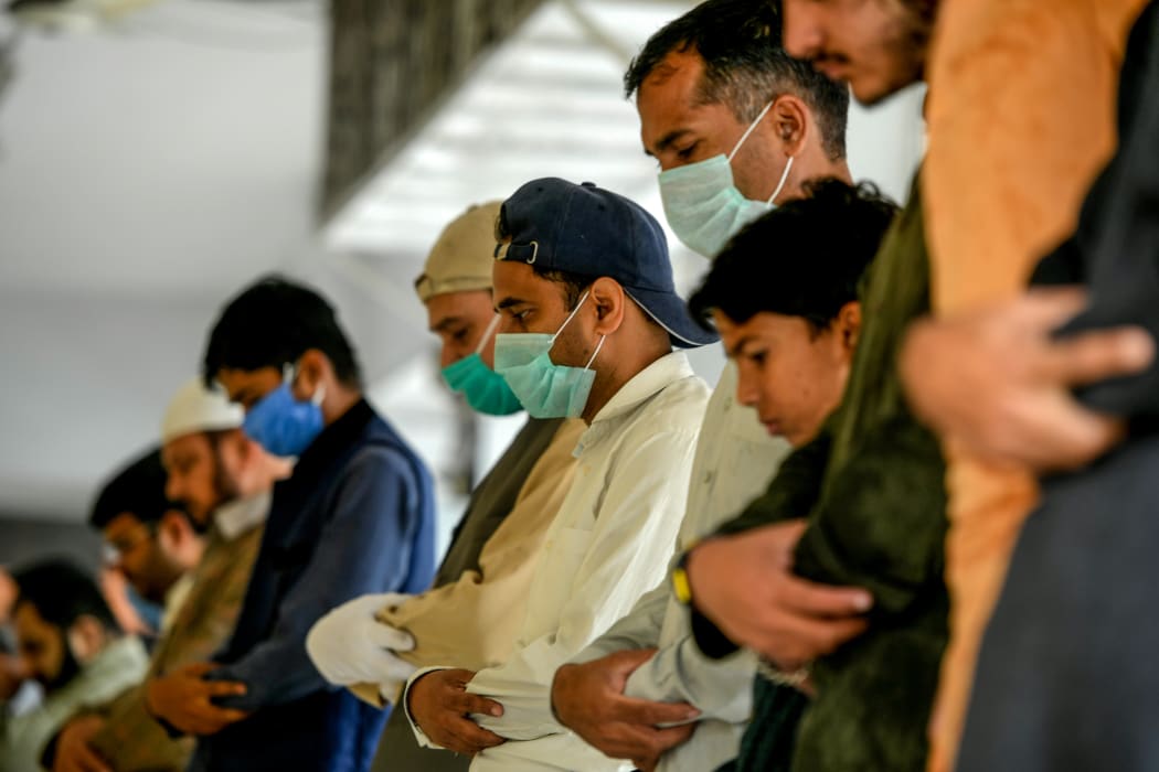 Muslims have been praying outside mosques during a government-imposed nationwide lockdown.