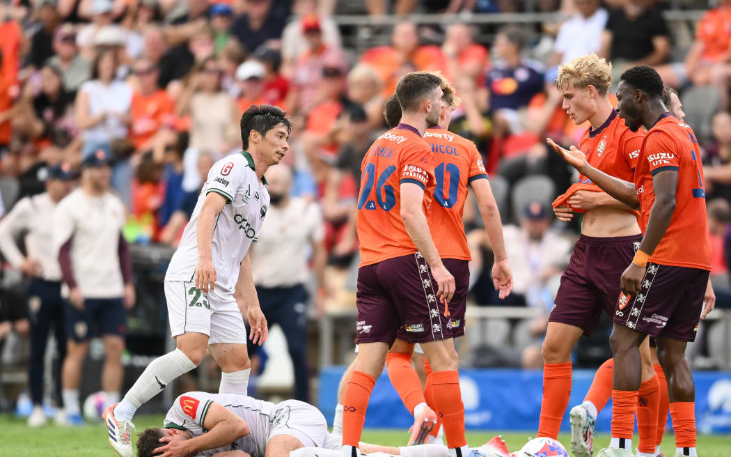 Wellington Phoenix and Brisbane Roar players involved in a melee.