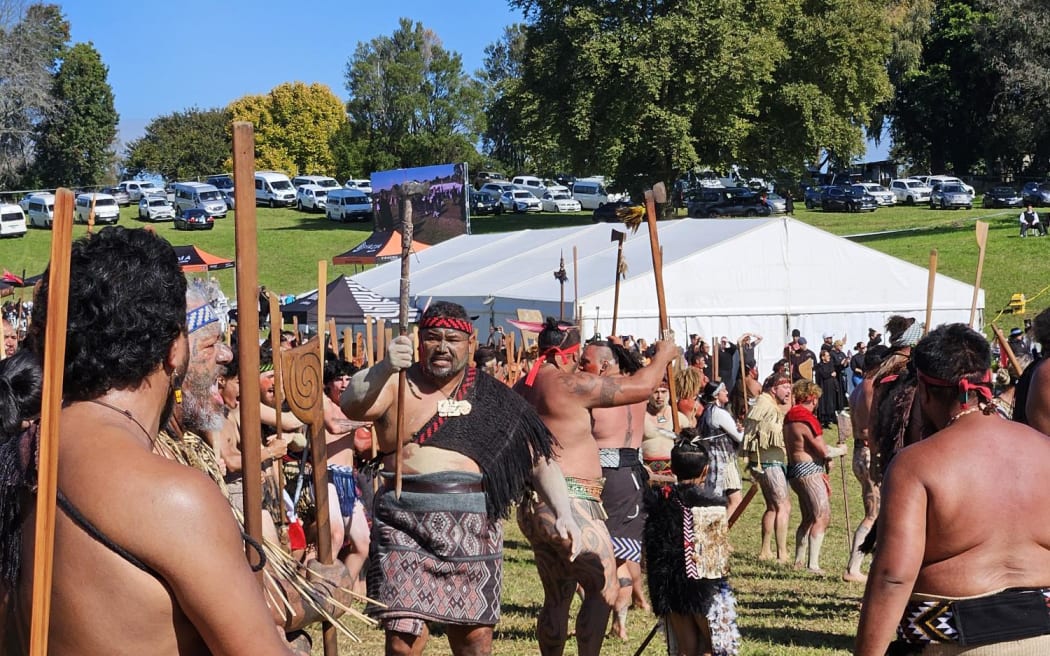 Members of Te Aka Rauwhero welcome Government representatives to Ōrākau