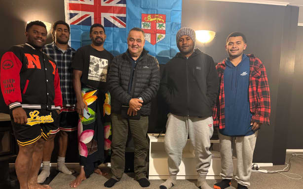 Fiji RSE country liaison officer Greg Traill, middle, with Fijian RSE workers in Motueka during one of his visits. Photo: Supplied