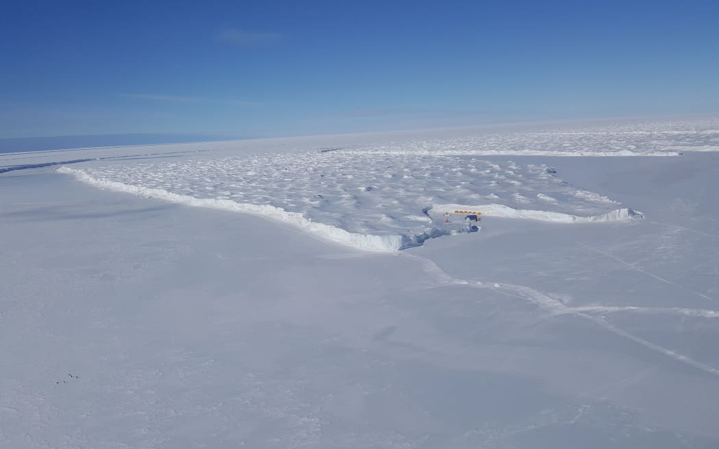 The Ross Ice Shelf meets the smooth annual sea ice at Cape Crozier on Ross Island. The cliffs mark the seaward edge of the largest ice shelf in the world, about the size of France.