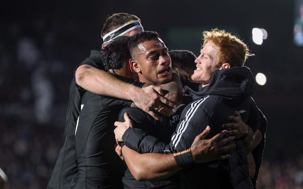 Shannon Frizell surrounded by teammates after scoring a try for the All Blacks against the Springboks.