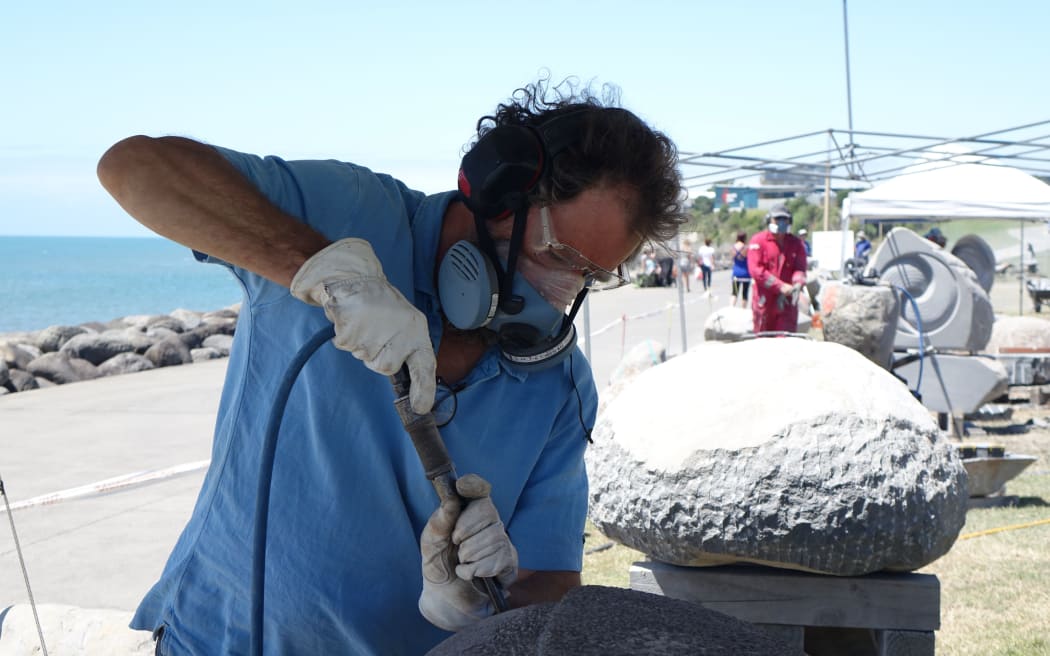 Englishman Anthony Turner works on his piece at the Te Kupenga International Stone Sculpture Symposium in New Plymouth.