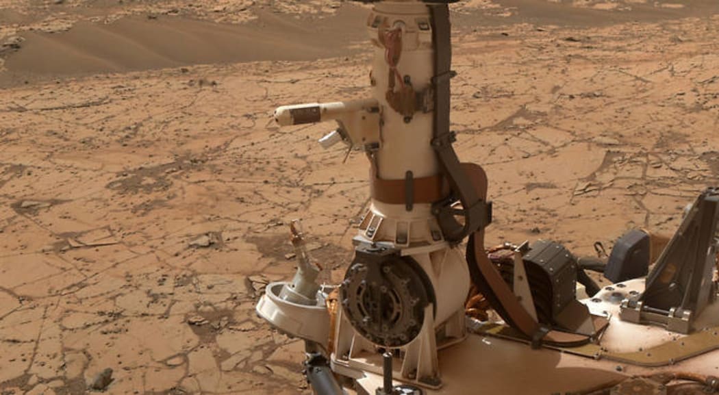 The Rover Environmental Monitoring Station (REMS) on NASA's Curiosity Mars rover includes temperature and humidity sensors mounted on the rover's mast. One of the REMS booms extends to the left from the mast in this view.