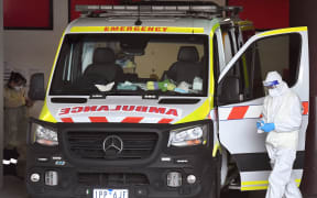An ambulance is cleaned at the Royal Melbourne Hospital in Melbourne on October 9, 2021, as Victoria state recorded 1965 new Covid cases, its highest daily infection number since the start of the pandemic, putting more pressure on the state's struggling health system.