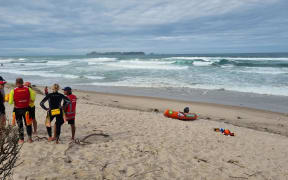 Surf Lifesaving crews at Opoutere Beach after a group of seven people signalled for help.