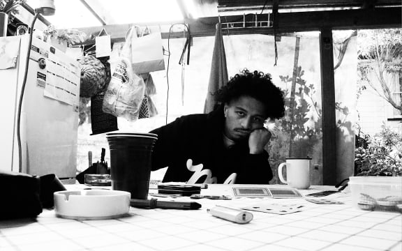 Diggy Dupé at home with a cup of tea.