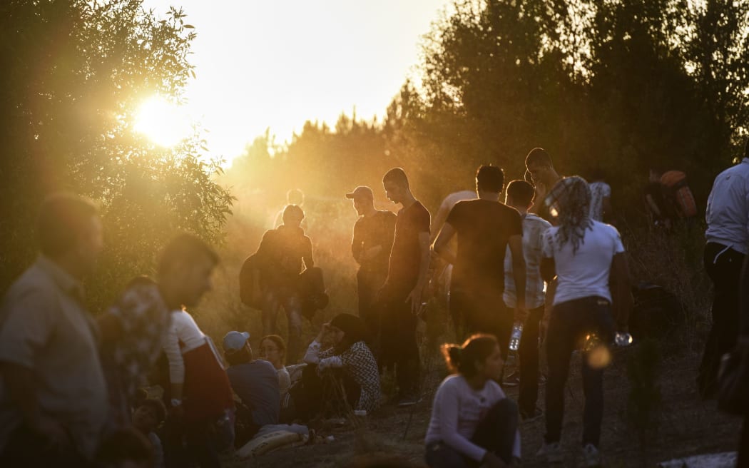 Syrian refugees and migrants gather on their way to the border between Turkey and Bulgaria in the northwestern Turkish city of Edirne.