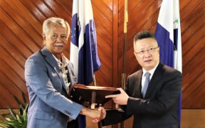 Pacific Islands Forum secretary-general Henry Puna, left, and China's Special Envoy for Pacific Island Countries Affairs Qian Bo.