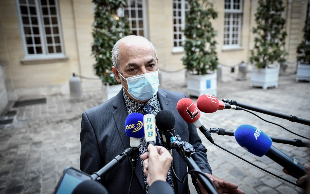 New Caledonia's delegate Gilbert Tyuienon from "Union caledonienne" political group speaks to journalists following a meeting with French Prime Minister, on May 26, 2021 at the Hotel de Matignon, in Paris. (Photo by STEPHANE DE SAKUTIN / AFP)