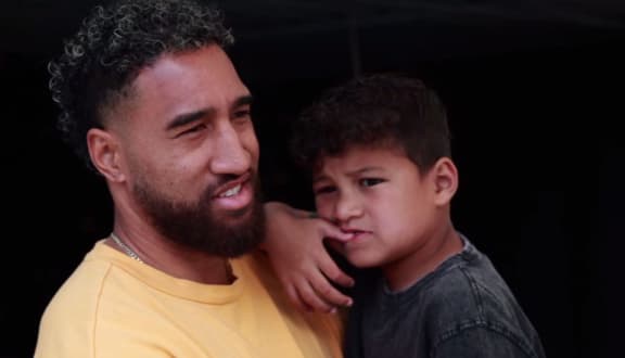 ASD Dads support group founder, Jordan Ikitule with his son.