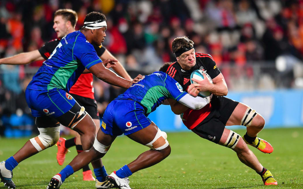 Scott Barrett of the Crusaders is tackled by Joseva Tamani of Fijian Drua during the Super Rugby Pacific match, Crusaders Vs Fijian Drua, at Orangetheory Stadium, Christchurch, New Zealand, 20th May 2022. Copyright photo: John Davidson / www.photosport.nz