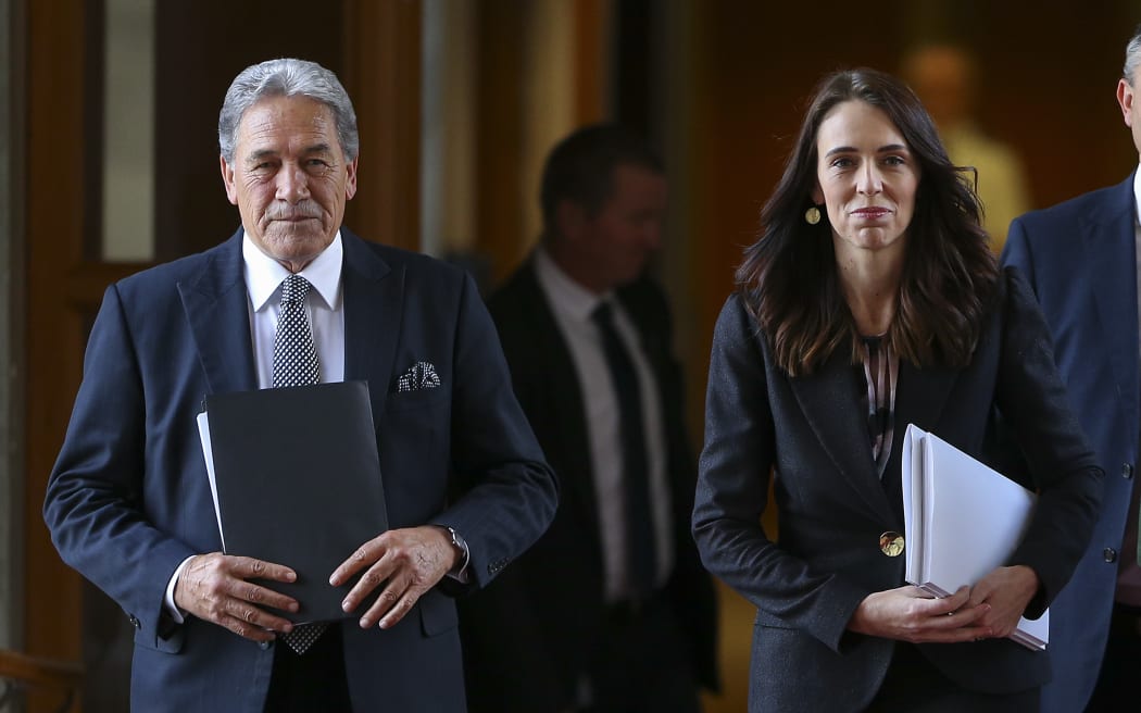 WELLINGTON, NEW ZEALAND - MAY 14: Deputy Prime Minister Winston Peters and Prime Minister Jacinda Ardern walk to the house during Budget 2020 delivery day at Parliament May 14, 2020 in Wellington, New Zealand. Budget 2020 is the second budget handed down by Finance Minister Grant Robertson, with a focus on funding to create and retain jobs in the wake of the COVID-19 pandemic. (Photo by Hagen Hopkins/Getty Images)
