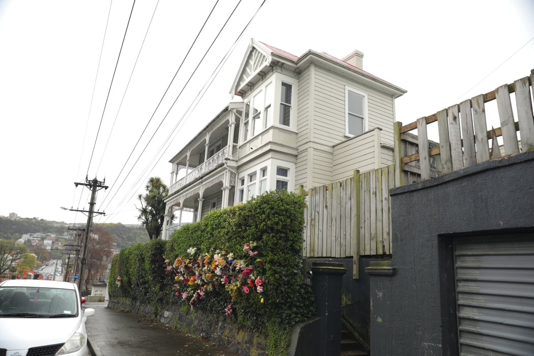 Flowers placed outside the flat in Dundas Street, Dunedin where 19-year-old Sophia Crestani died during a party on Saturday 5 October.