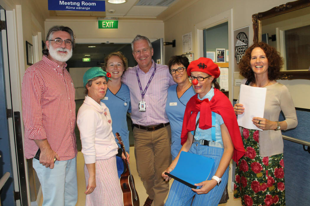 A photo of the clown doctors team with Princess Margaret Hospital staff. From left; Thomas Petschner, Dr Poppy, Pip Hyde, Andrew Henderson, Lois Robertson, Dr Betty, Rita Noetzel