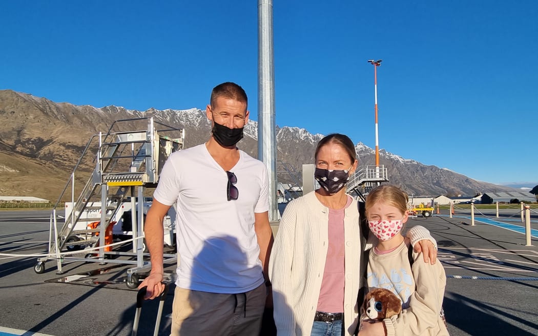 A family arrives on a trans-Tasman flight to Queentown airport.