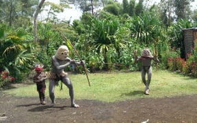 Traditionally garbed Papua New Guinea mudmen.