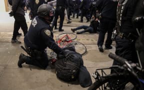 Police arrest election protestors after they marched the streets in Manhattan at Union Square in New York City.