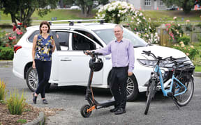 Rehette Stoltz with the new mayoral car – a Mitsubishi Outlander hybrid – and Gisborne District Council asset manager Simon Jeune with one of the council’s e-scooters and an e-bike, which are part of a drive to get the council moving in an environmentally friendly way
