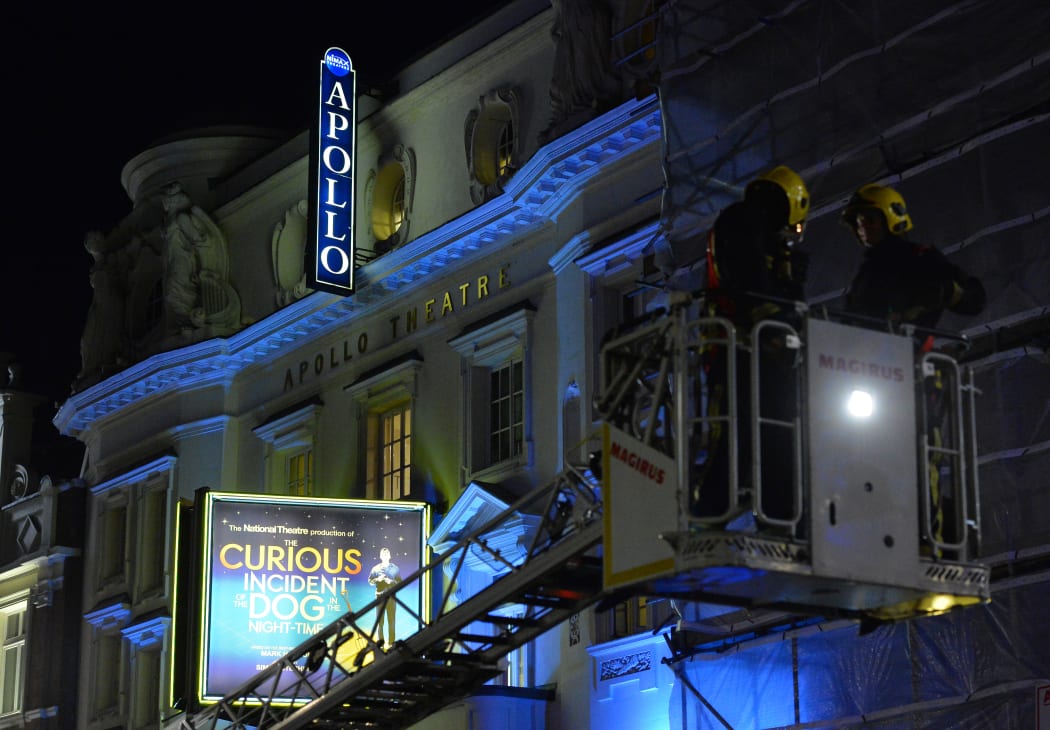 Emergency services investigate the cause of the ceiling's collapse.