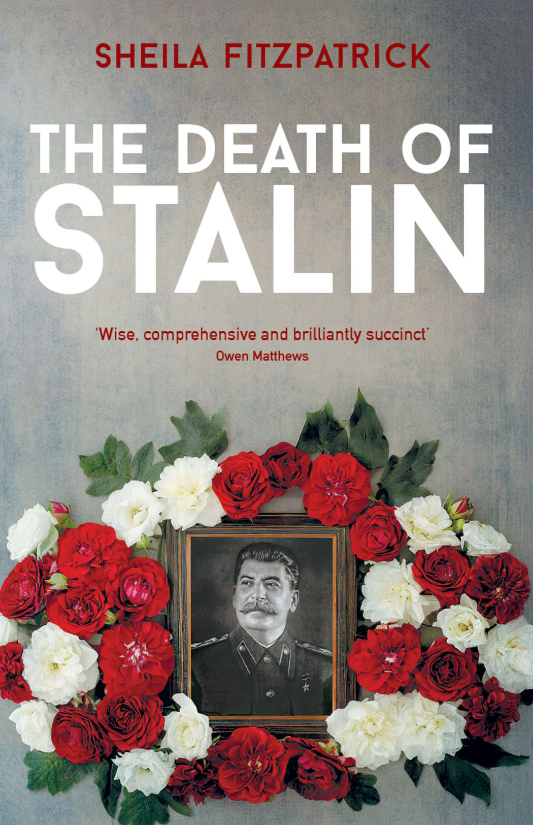 The cover of the book "The Death of Stalin". It features a framed portrait of Stalin surrounded by a red and white flower wreath.