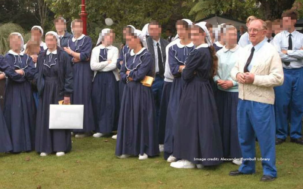 Members of Gloriavale commune at a gathering. Founding member Hopeful Christian stands on the right.