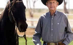 Aussie cowboy Bob Holder wearing his prized belt buckle.