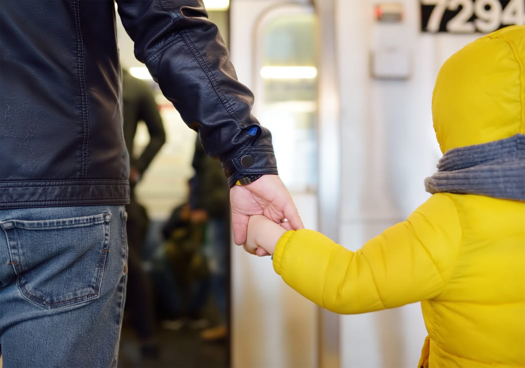 Man and child / son taking transport.