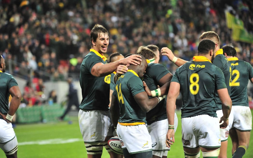 Springboks celebrate a try against the Pumas