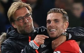 Jurgen Klopp (L) manager of Liverpool celebrates with Jordan Henderson (R).