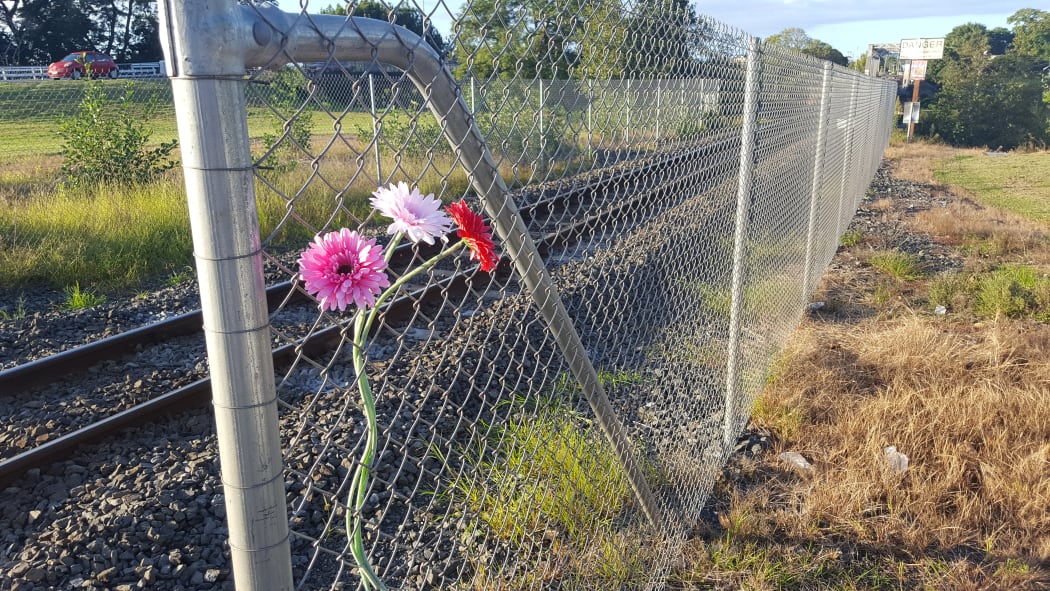 Flowers left near the site of a young girl's death on Ngaruawahia's rail bridge.