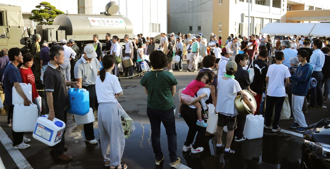 Locals wait in line for water supply in Atsuma Town, Hokkaido