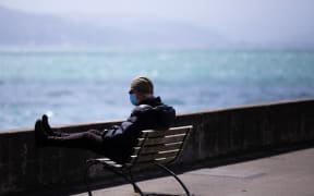 Man wearing a mask on Oriental Parade