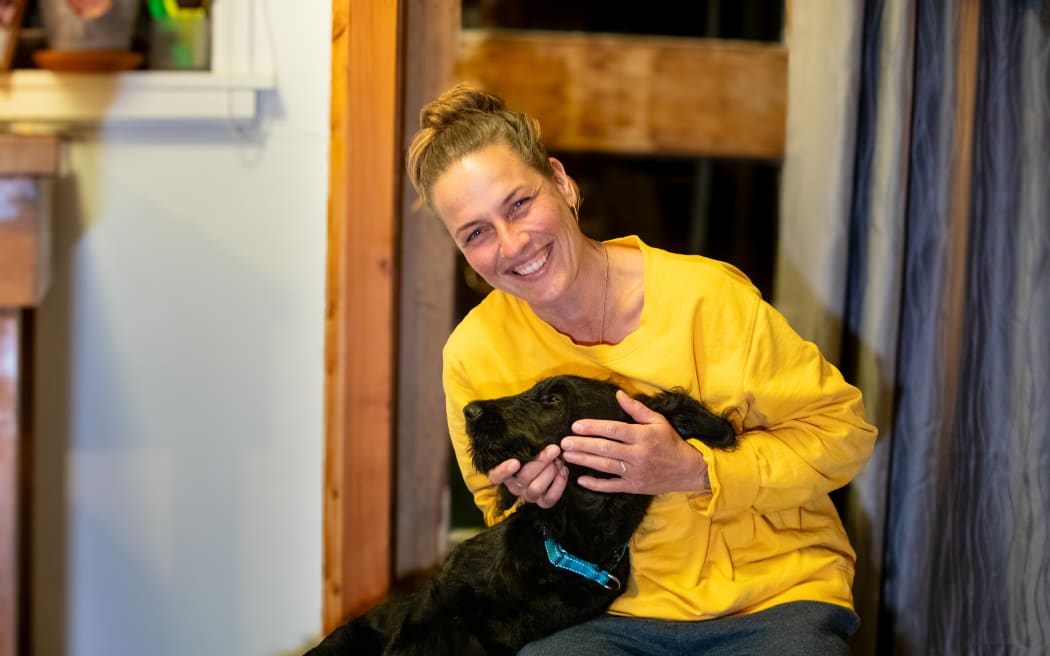 Motueka Valley resident Kate Gloeggler and three-month-old puppy, Kahu.