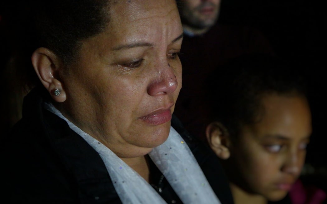 A woman at the vigil who gave the opening prayer.