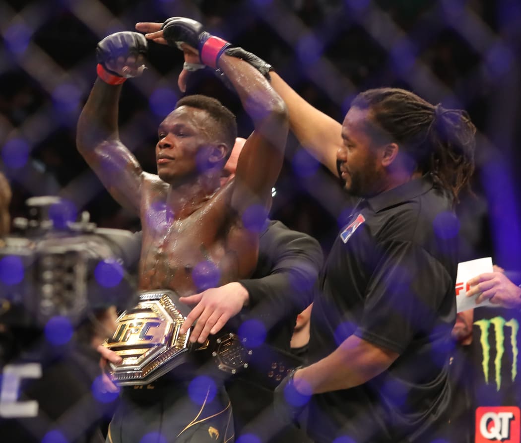 Israel Adesanya poses after his unanimous decision victory over Robert Whitakker on February 12 2022 at UFC 271 in Houston, Texas