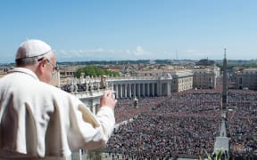 Pope Francis delivers the Urbi et Orbi blessing from the balcony of St Peter's.