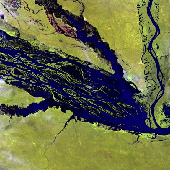 Fed by multiple waterways, Brazil's Negro River is the Amazon River's largest tributary. The mosaic of partially-submerged islands visible in the channel disappears when rainy season downpours raise the water level.