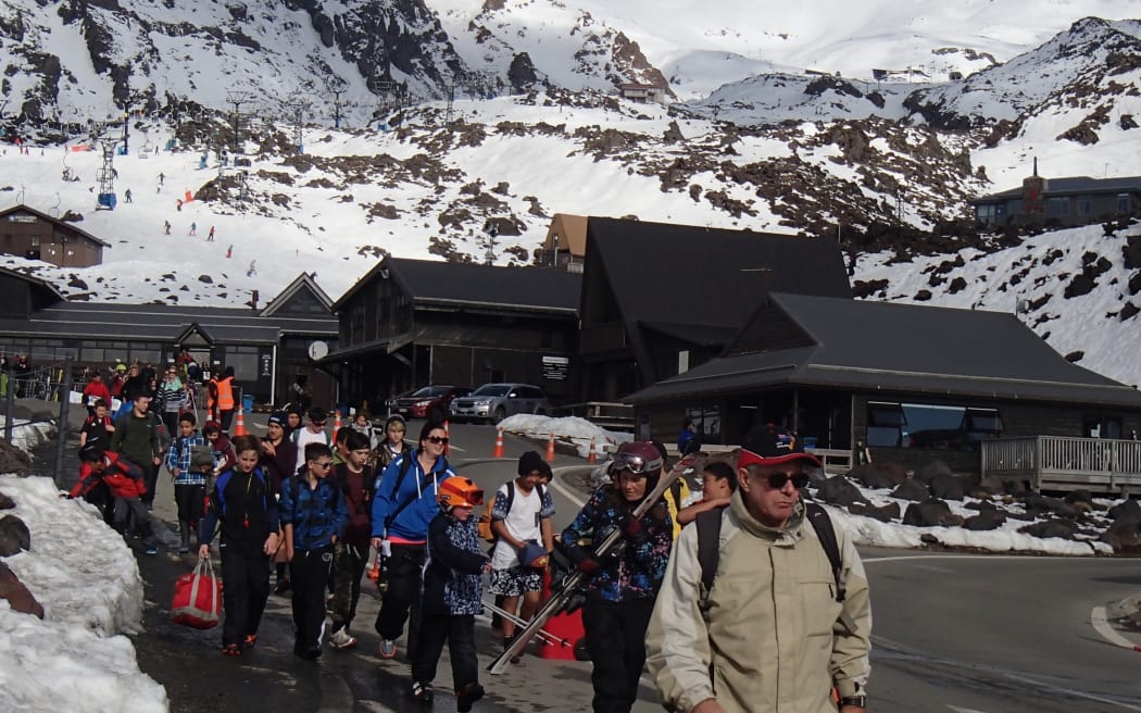 On a busy day, the Whakapapa ski area on Mount Ruapehu hosts thousands of visitors, seen here leaving the field at the end of a fine day.