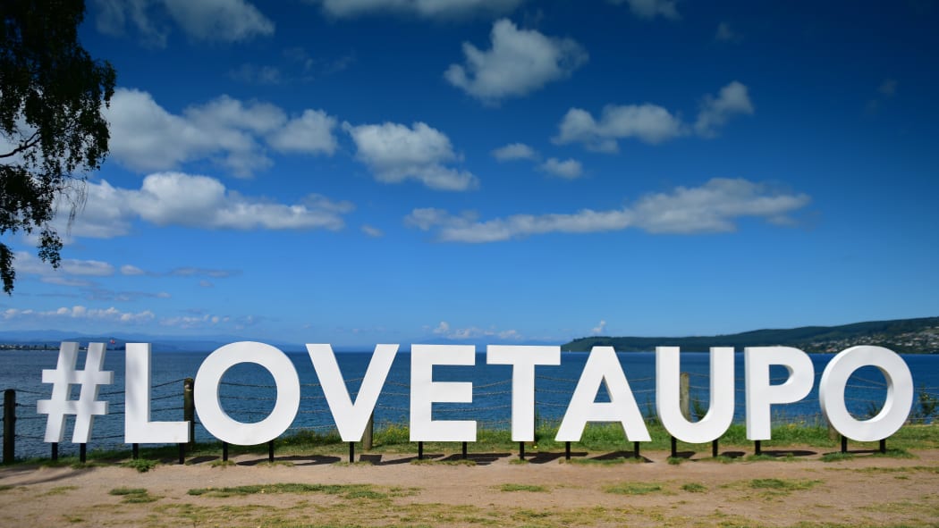 "#LOVETAUPO" sign next to Lake Taupo.