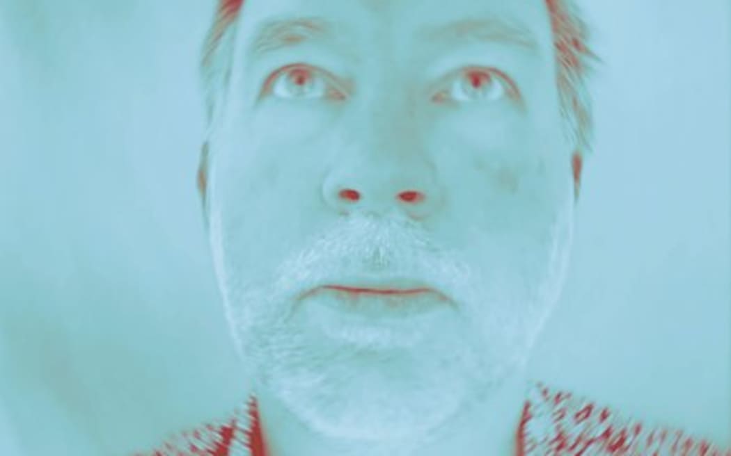 SJD looks above the camera in a saturated image