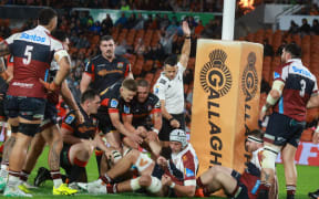 Luke Jacobson scores during the Chiefs v Reds, Super Rugby Pacific match, FMG Stadium, Hamilton.