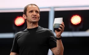Google vice president of product management Mario Queiroz with a Google Home Device.