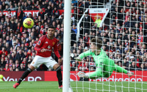 Crystal Palace's English goalkeeper #01 Dean Henderson (R) saves a shot from Manchester United's Brazilian midfielder #18 Casemiro during the English Premier League football match between Manchester United and Crystal Palace at Old Trafford in Manchester, north west England, on March 1, 2026. (Photo by Darren Staples / AFP) / RESTRICTED TO EDITORIAL USE. NO USE WITH UNAUTHORIZED AUDIO, VIDEO, DATA, FIXTURE LISTS, CLUB/LEAGUE LOGOS OR 'LIVE' SERVICES. ONLINE IN-MATCH USE LIMITED TO 120 IMAGES. AN ADDITIONAL 40 IMAGES MAY BE USED IN EXTRA TIME. NO VIDEO EMULATION. SOCIAL MEDIA IN-MATCH USE LIMITED TO 120 IMAGES. AN ADDITIONAL 40 IMAGES MAY BE USED IN EXTRA TIME. NO USE IN BETTING PUBLICATIONS, GAMES OR SINGLE CLUB/LEAGUE/PLAYER PUBLICATIONS. /